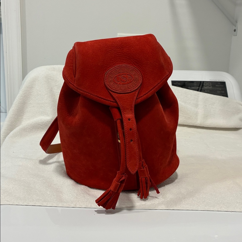 Dooney small red nubuck back pack / purse with gold trim